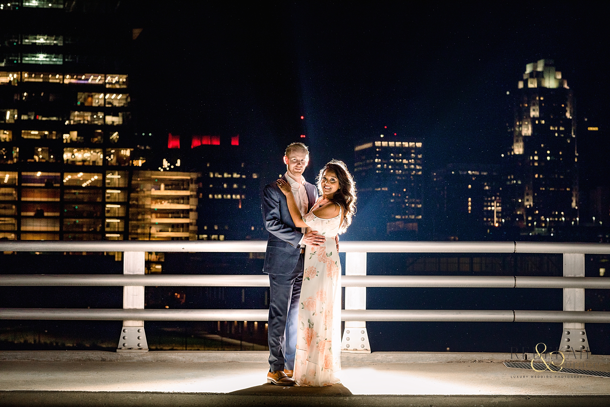 Engagement Photography | Night city lights in Downtown Raleigh, North Carolina. | Photography by Rebekah & Grace Photography.